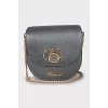 Gray crossbody bag with gold hardware