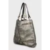 Shopper bag decorated with zippers