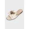 Leather slides with gold decoration