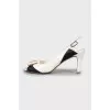 Black and white sandals with decor