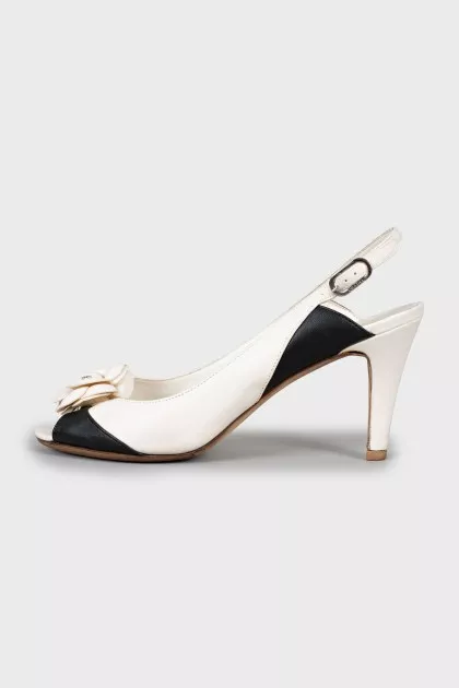 Black and white sandals with decor