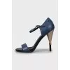 Leather sandals with decorative heels