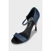 Leather sandals with decorative heels