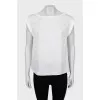 White blouse with slits on the sides