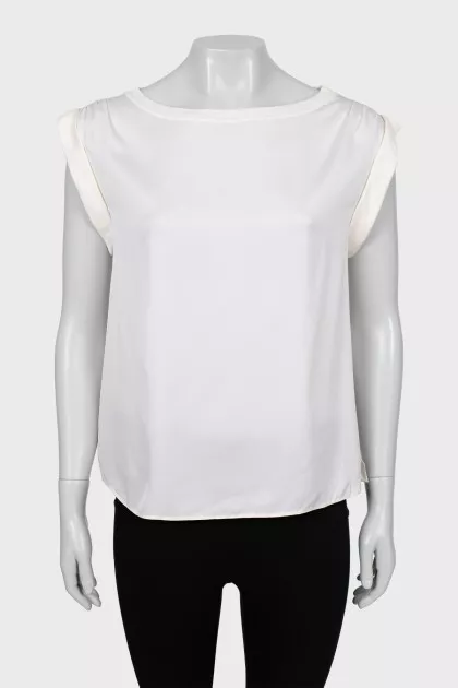 White blouse with slits on the sides