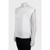 White blouse with slits on the sides