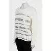 Knitted sweater with silver print