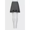 Skirt decorated with lace with a slit