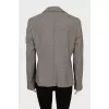 Jacket with a button in a small print