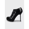 Black leather ankle boots with stiletto heels