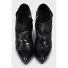 Black leather ankle boots with stiletto heels