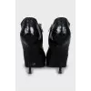 Black leather ankle boots with stiletto heels