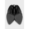Black leather ankle boots with stiletto heels