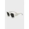 White sunglasses with logo on arms