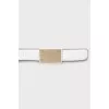White belt with gold buckle