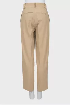 Beige trousers with arrows