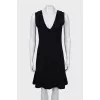 Fitted black dress with perforations