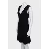 Fitted black dress with perforations