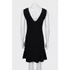 Fitted black dress with perforations