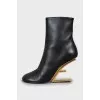 Leather ankle boots with gold heels