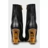 Leather ankle boots with gold heels