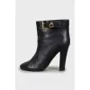 Leather ankle boots with gold buckle