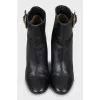 Leather ankle boots with gold buckle