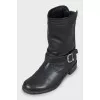Leather boots decorated with buckle