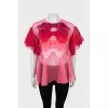 Loose blouse decorated with bows