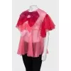 Loose blouse decorated with bows
