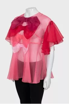 Loose blouse decorated with bows
