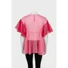 Loose blouse decorated with bows