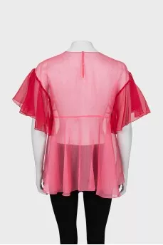 Loose blouse decorated with bows