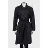 Black raincoat with embossed print