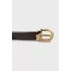Leather belt with gold buckle