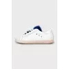 Leather sneakers with fur tongue