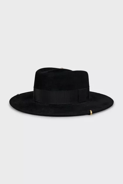 Black hat with metallic decoration