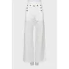 Palazzo trousers decorated with buttons