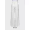 Palazzo trousers decorated with buttons