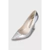 Silver shoes with decorative heels