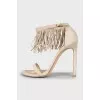 Suede sandals decorated with fringes