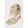 Suede sandals decorated with fringes