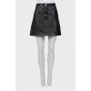 Leather miniskirt with signature print