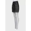 Leather miniskirt with signature print