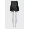 Leather miniskirt with signature print