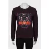 Purple sweatshirt with embroidered print