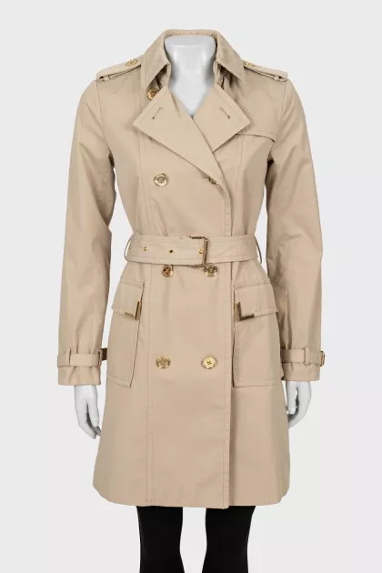 Beige trench coat with gold buttons