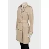 Beige trench coat with gold buttons