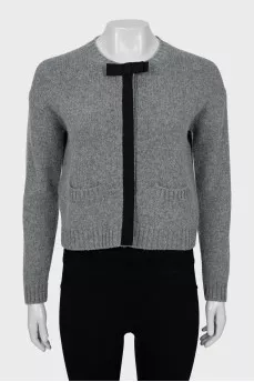 Knitted cardigan decorated with a bow