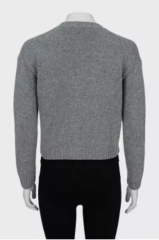 Knitted cardigan decorated with a bow
